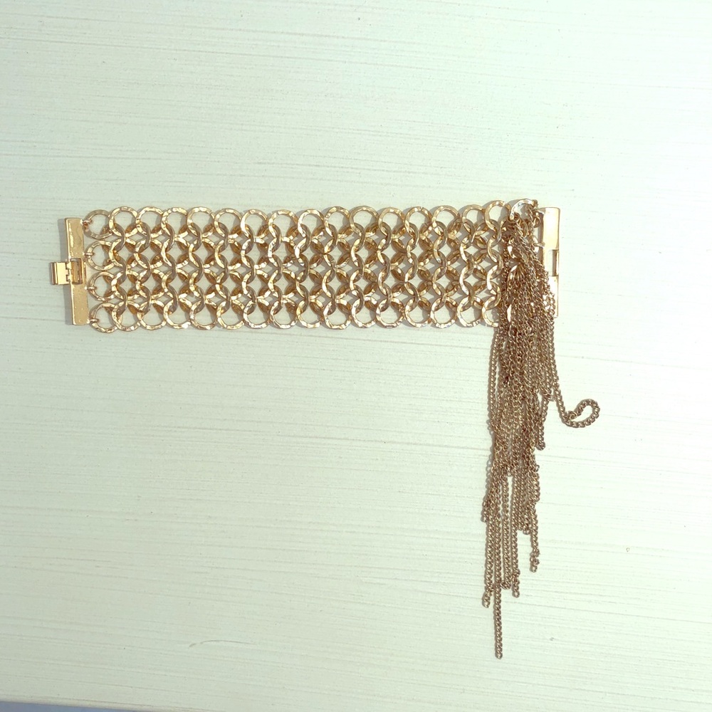 Gold tone bracelet with fringes